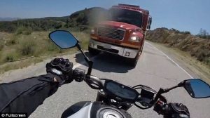 motorcycle dealing with trucks